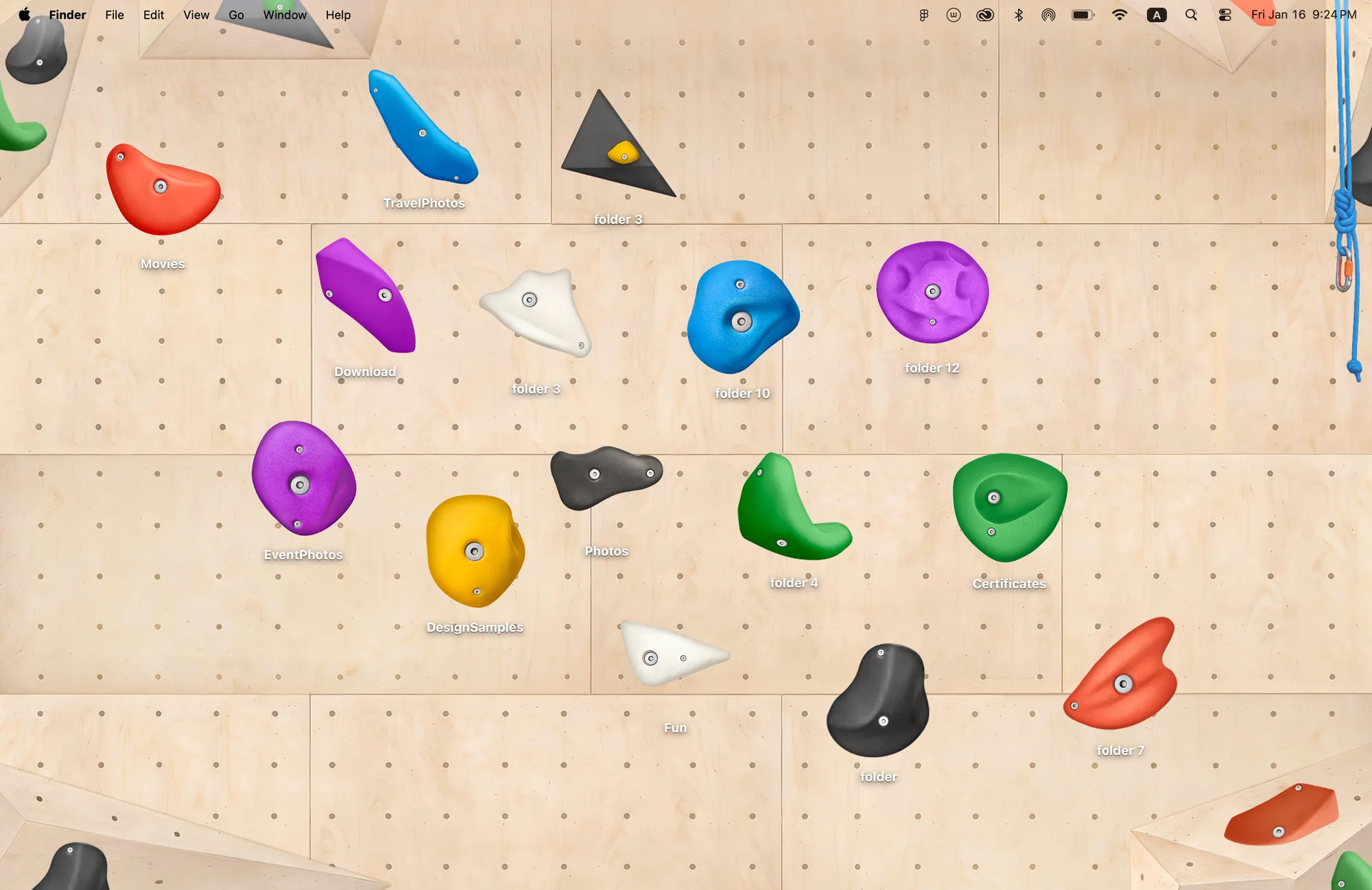 Climbing Wall climbing wallpaper for MacBook, a plywood bouldering wall with 15 colorful climbing hold folder icons